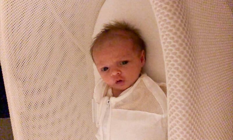 Newborn baby in Snoo bassinet