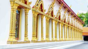 A row of gold trimmed doorways on the Chana Songkhram Temple in Bangkok Thailand