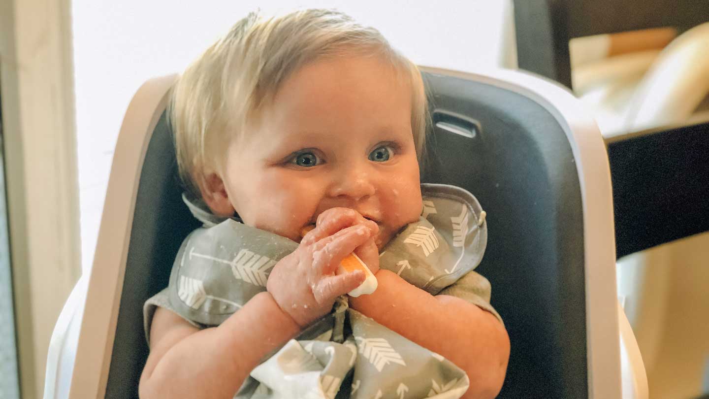 baby with teething spoon