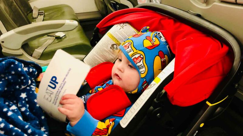 infant flying with Doona car seat on airplane