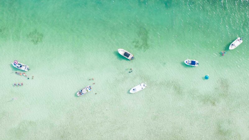Aerial view of boats gathered for a party at Crab Island in Destin Florida