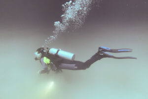 a diver descending into the cloud in Angelita