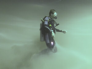 diver accending from the hydrogen sulfide cloud of cenote Angleita