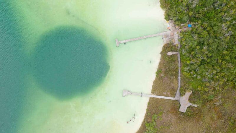 Aerial drone view of the docks of Kaan Luum Lagoon and cenote