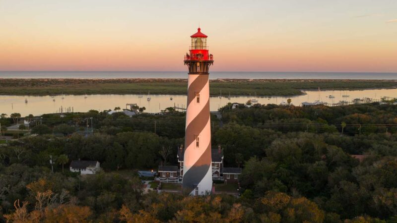 Red and white striped lighthouse in St. Augustine FL at sunset