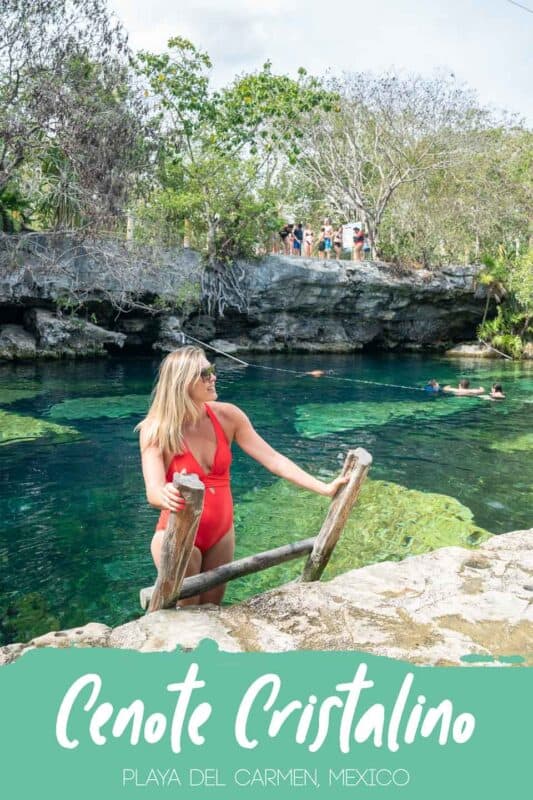 woman standing on a ladder exiting the aqua color waters of Cenote Cristalino