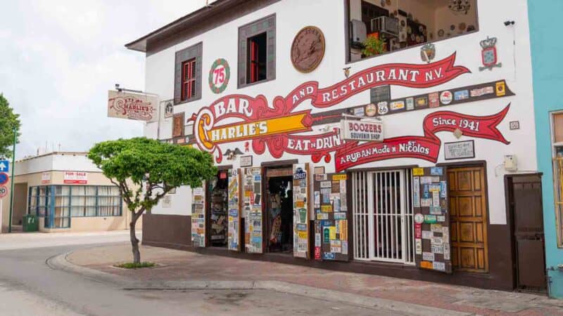 view of the red a white exterior of Charlie's Bar and Restaurant in Aruba