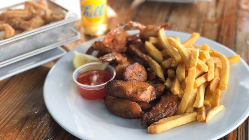 Plate of fried shrimp, plantains, and french fries served at the Pelican Pier - Favorite Picks for Aruba restaurants