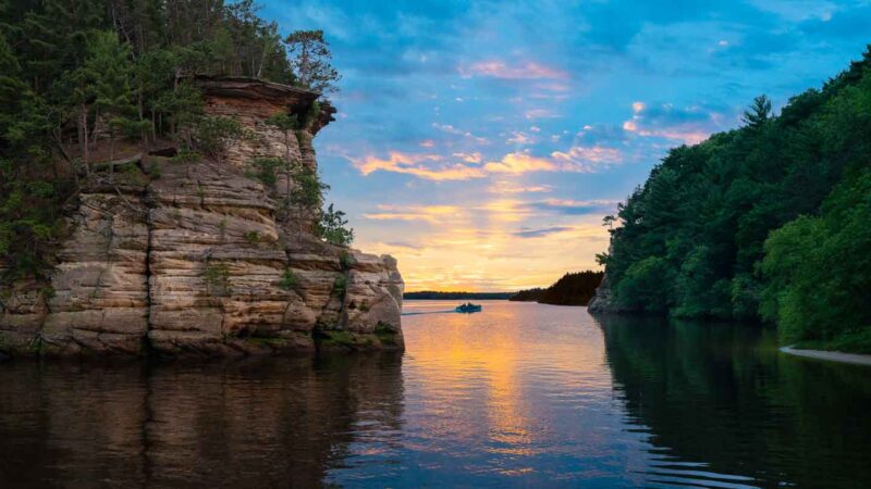 view of Wisconsin Dells from a sunset boat tour - top destinations in Wisconsin