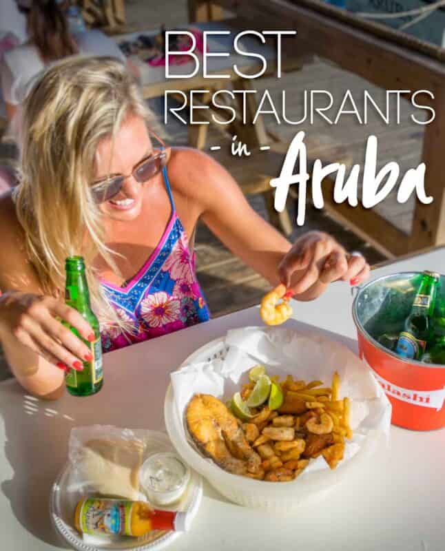 woman eating local seafood at a seaside restaurant in Aruba - Pin