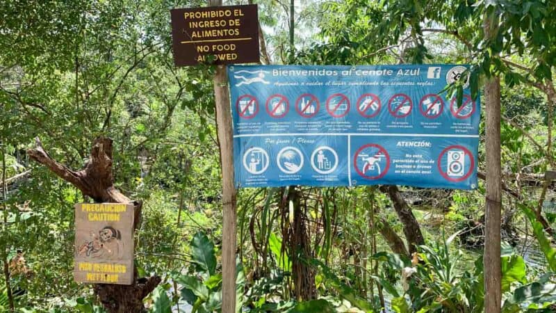 blue rule board at cenote azul near playa del carmen and tulum mexico