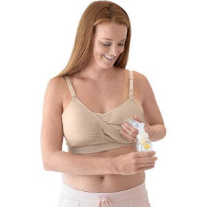 woman using a Kindred Bravely Sublime Hands Free Pumping Bra