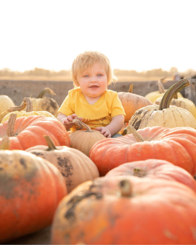 baby boy with pumpkins in Wisconsin
