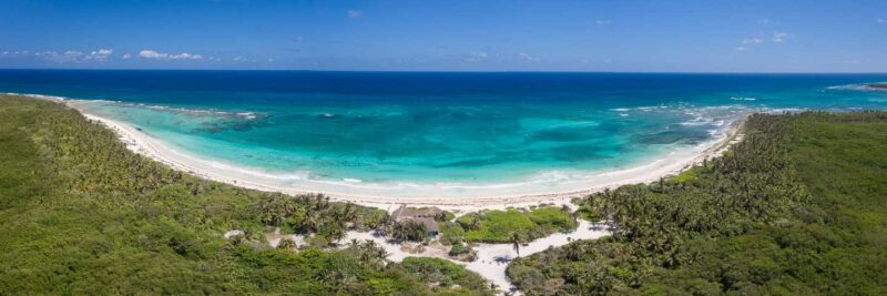 wide panoramic drone photo of the bay of Playa Xcacel Beach