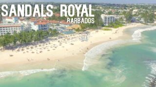 View of the beach and proerty at sandals Royal Barbados for the featured image with white text