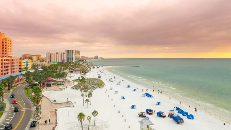 Aerial view of Clearwater Beach with blue umbrellas in the sand