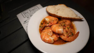 Bowl of pink Shrimp served with a roll and delicius sauce at doc ford's - one of the best restaurants in St. Petersburg