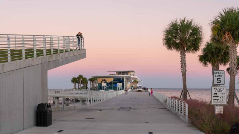 view looking down the St Petersburg Pier during a pink and purple sunset