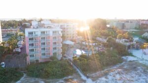 Aerial view of the Beach house Suites on St Pete Beach - Perfect family vacation hotel