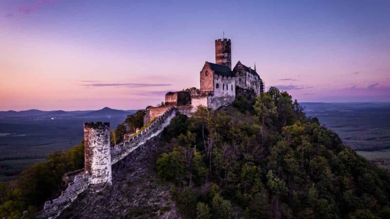 aerial view of Bezdez Castle located on a hill top in Czech Republic - photo at sunset