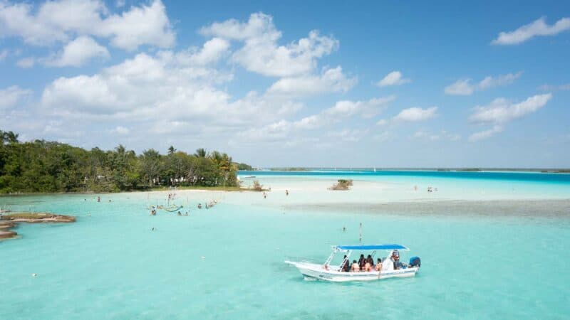 white boat anchored near Cocalitos in Bacalar