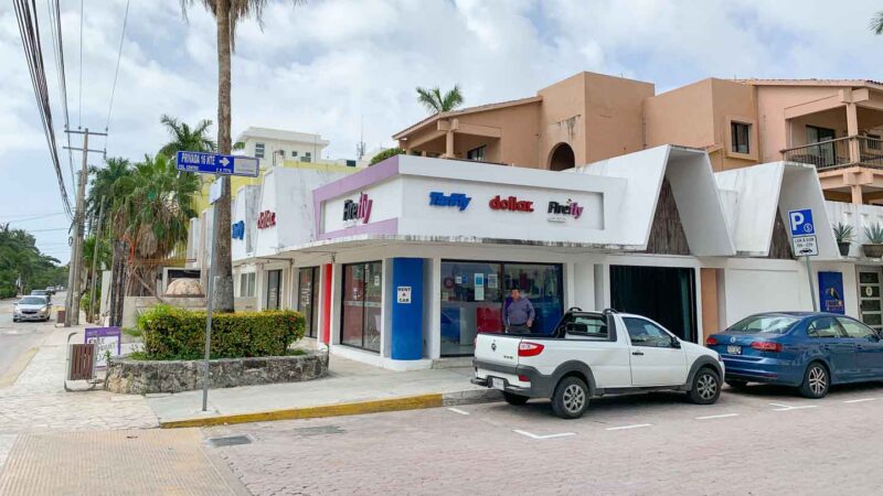 White building with some of the best car rental agencies in Playa del Carmen Mexico