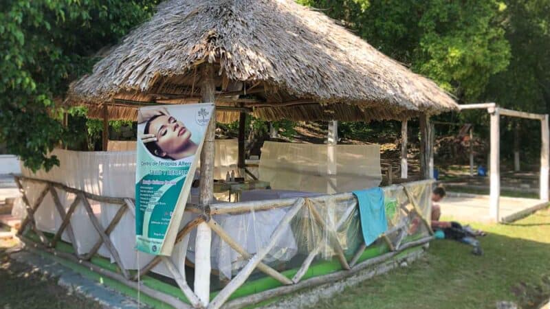 small thatched hut at Azul Cenote in the town of Bacalar Mexico