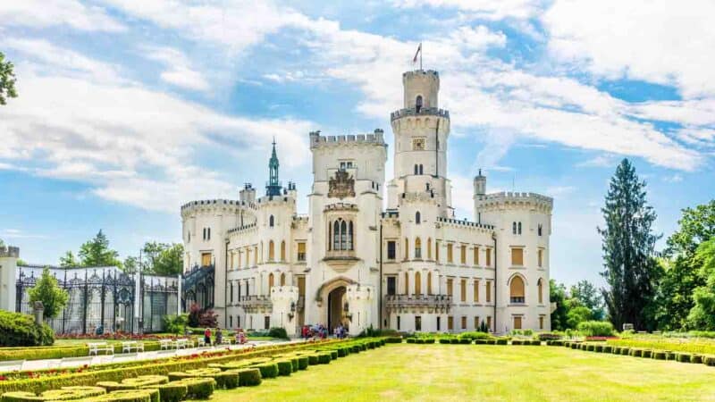 View of the white exterior of Hluboke Castle with extensive gardens