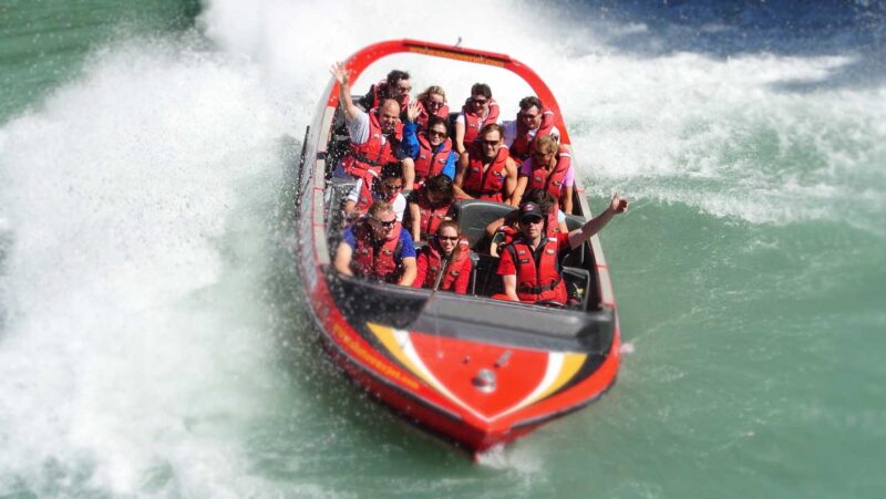 group of people on a red jet boat - Talkeetna Alaska attractions