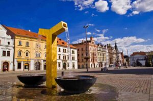 Gold water fountain statue in the town square of Pilsen one of the top destinations in Czech Republic