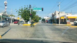 View from a rental car in Playa del Carmen at an intersection with stop and go lights