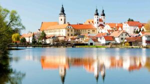 Old world buildings of Telč reflecting in the water - top places to visit in Czech Republic