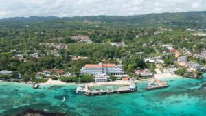 panoramic drone photo of Sandals Ochi Resort in Ocho Rios Jamaica showing the main beachside buildings