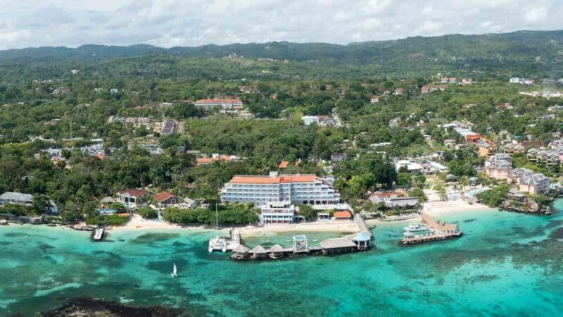 panoramic drone photo of Sandals Ochi Resort in Ocho Rios Jamaica showing the main beachside buildings