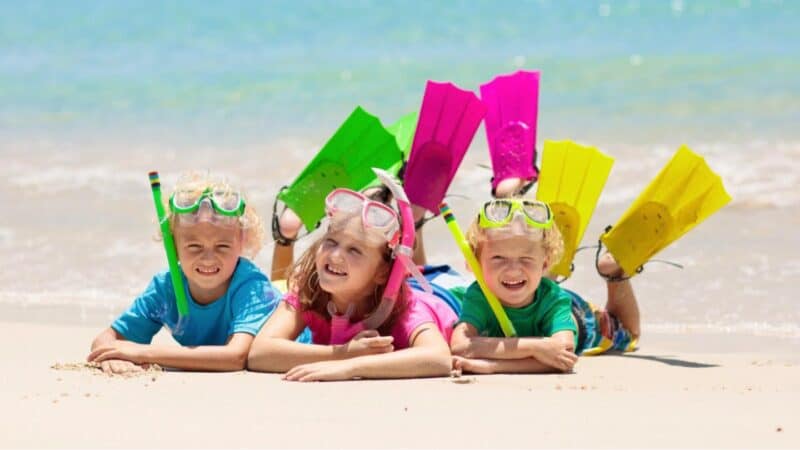 kids on the beach in snorkel gear