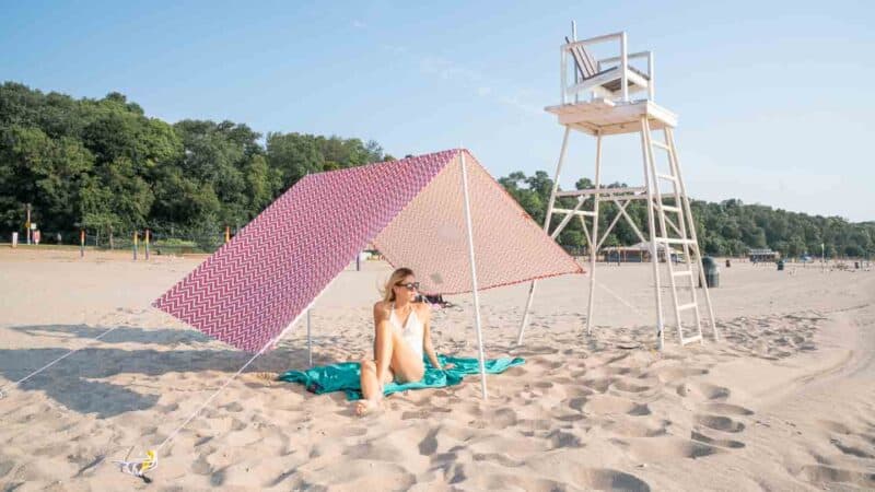 girl under tent at Bradford Beach in Milwaukee