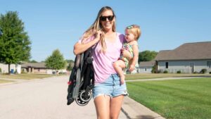 lightweight Joolz Aer stroller mom carrying baby