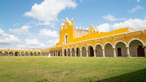 yellow colonial architecture and arches of the Convento de San Antonio Izamal