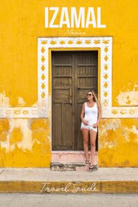 woman standing in a yellow building door way in Izamal Mexico - Pinterest pin