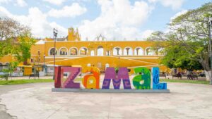view of the colorful letters spelling the city name of Izamal in the city plaza
