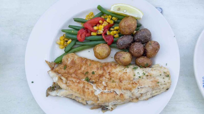 Plate of Walleye and potatoes and vegetables at pier 290 restaurant in Lake Geneva 