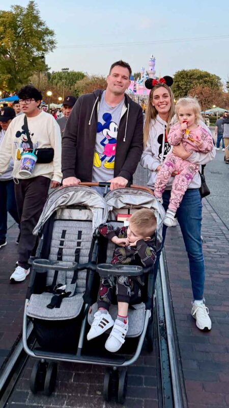 Family at Disneyland with double stroller