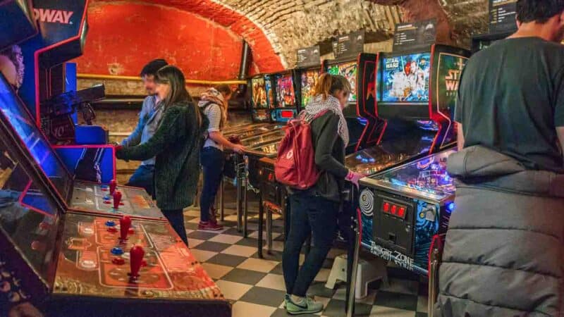 View of people playing games at the Budapest Pinball Museum