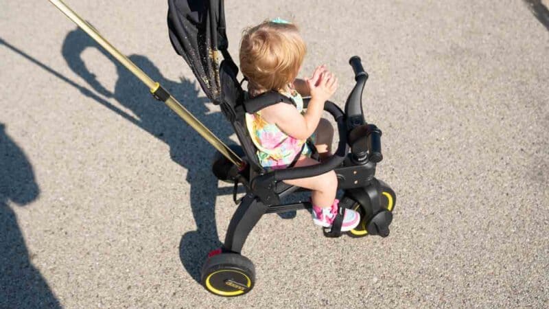 Doona Liki Trike top view with 1 year old girl riding