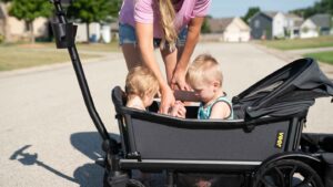 boy and girl in wagon stroller