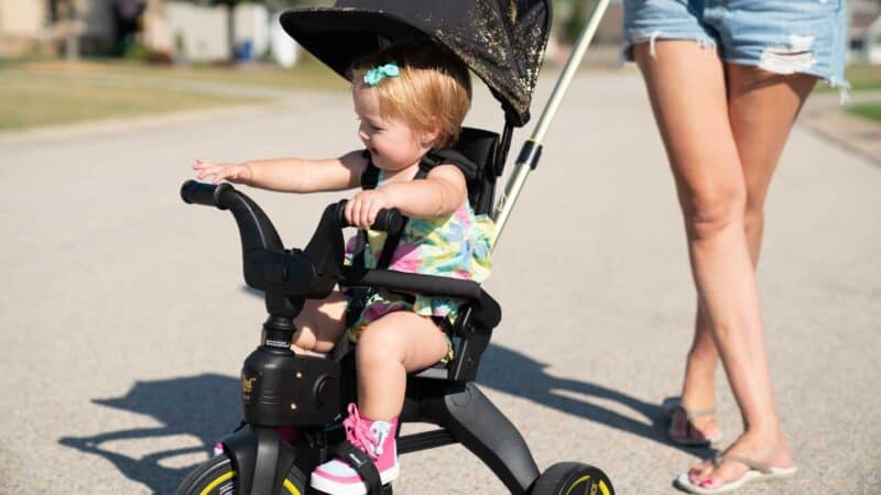 Girl riding Doona Liki Trike side view 2