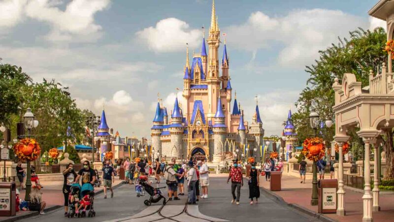 Families with strollers at Disney walking towards Magic Kingdom at Disney World in Florida