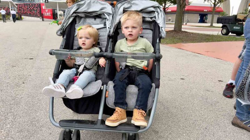 two kids in the Zoe Twin Stroller
