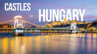 night view of the chain bridge and Buda Castle - featured image for Castles in Hungary with white text