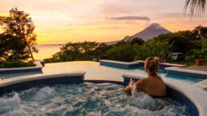 Ometepe Nicaragua girl in hot tub looking at volcano